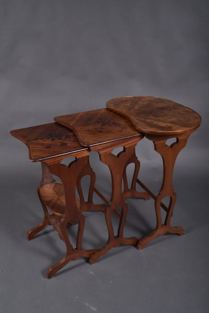Set of three nesting tables in walnut veneer...