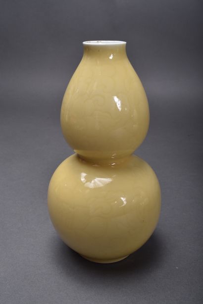 A pair of pale yellow porcelain double gourd...