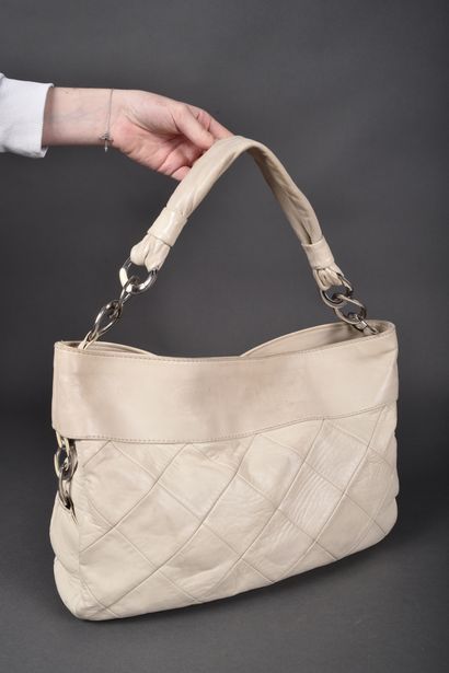 CHANEL
Off-white leather elongated bag with...