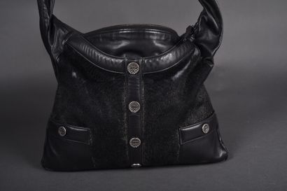 CHANEL.
Girl bag in black leather and iridescent...