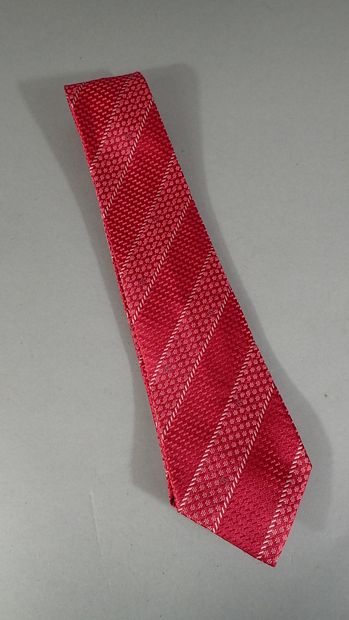 CHANEL. Silk tie with red background decorated...