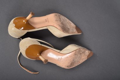 CHANEL
Pair of beige canvas pointed-toe pumps,...