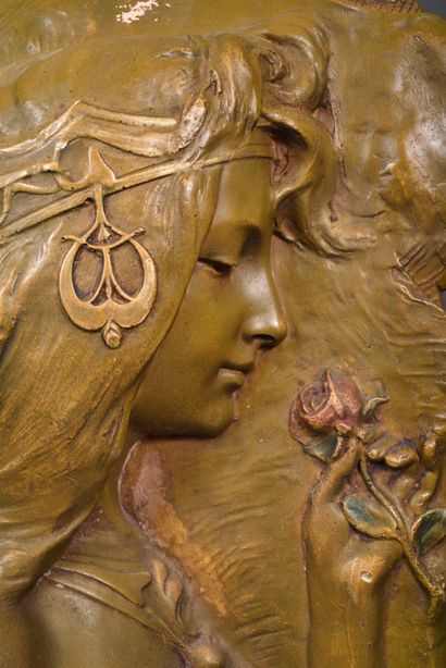 Group in green patinated terra cotta decorated...