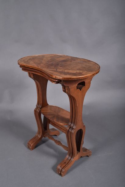 Set of three nesting tables in walnut veneer...