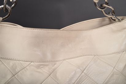 CHANEL
Off-white leather elongated bag with...