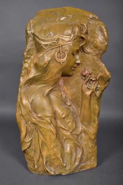 Group in green patinated terra cotta decorated...