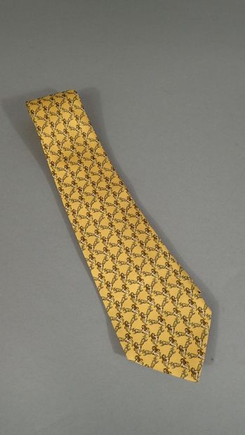 CHANEL. Silk tie with yellow background,...