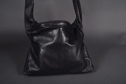 CHANEL.
Girl bag in black leather and iridescent...