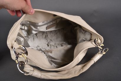 CHANEL
Off-white leather elongated bag with...