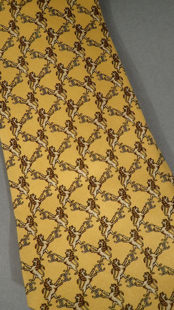 CHANEL. Silk tie with yellow background,...
