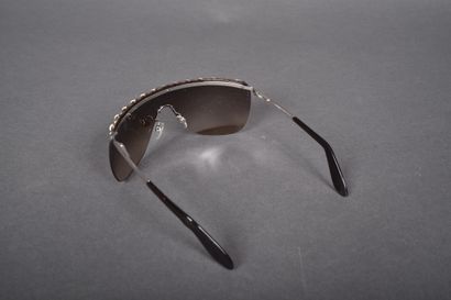 CHANEL
Pair of mask-style sunglasses embellished...