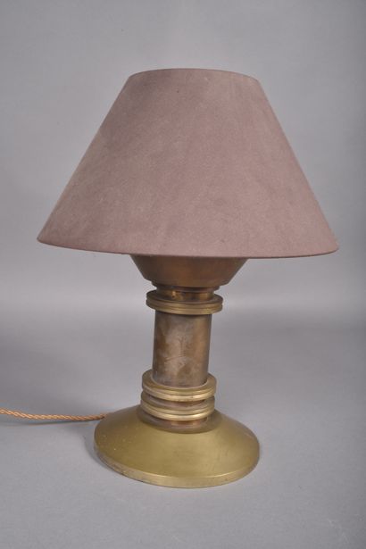 A diabolo-shaped bronze lamp with a cylindrical...