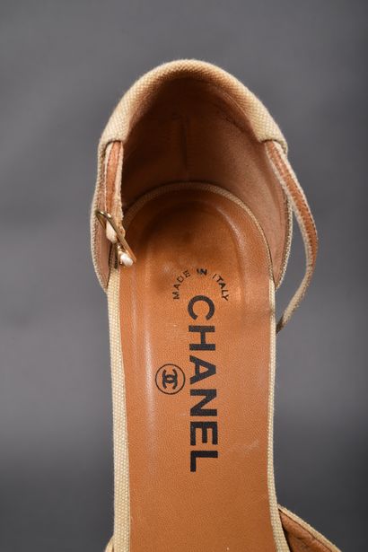 CHANEL
Pair of beige canvas pointed-toe pumps,...