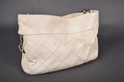CHANEL
Off-white leather elongated bag with...