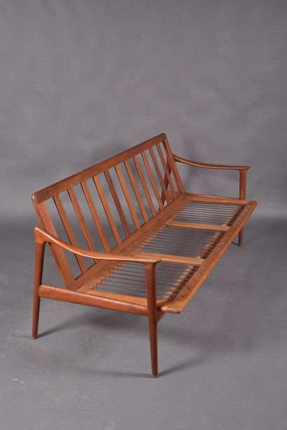 Scandinavian teak three-seater bench resting...