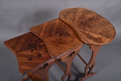 Set of three nesting tables in walnut veneer...