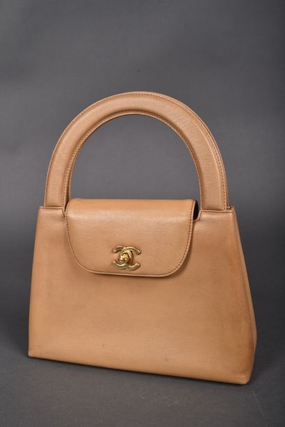 CHANEL
Small handbag in beige grained leather,...