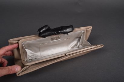 CHANEL
Elongated clutch in beige lambskin...