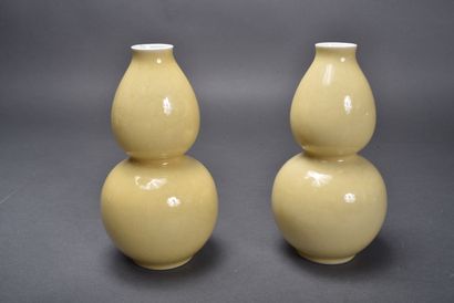 A pair of pale yellow porcelain double gourd...