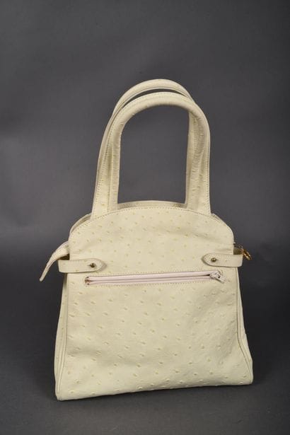 CLAUDE GERARD
Hand-held bag in very light...