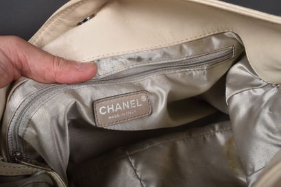 CHANEL
Off-white leather elongated bag with...