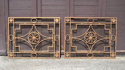 Pair of gilded patinated wrought-iron grilles...