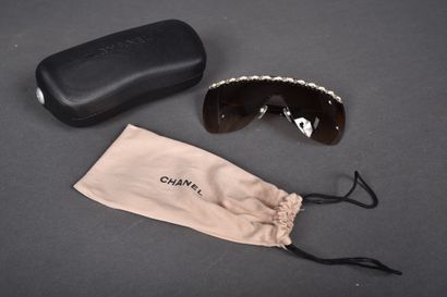CHANEL
Pair of mask-style sunglasses embellished...