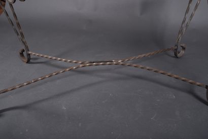 Wrought-iron coffee table with twisted structure...