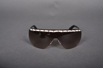 CHANEL
Pair of mask-style sunglasses embellished...