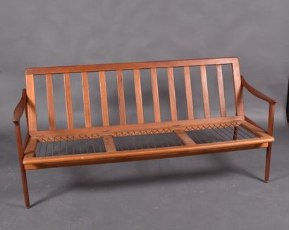 Scandinavian teak three-seater bench resting...