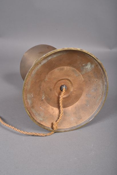 A diabolo-shaped bronze lamp with a cylindrical...