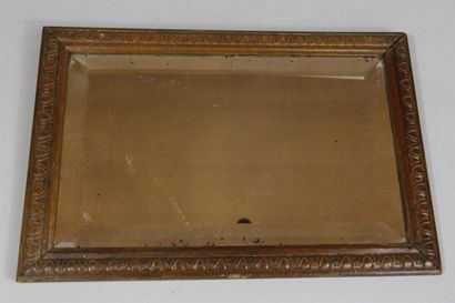 Miroir en verre biseauté dans un cadre en...