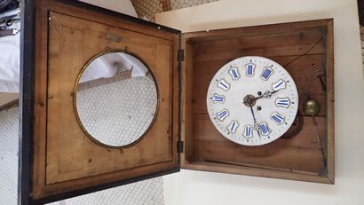 Grande pendule œil de bœuf en bois noirci...
