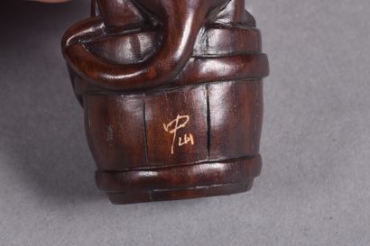 Set of three carved wood netsukes: 
- a pair...