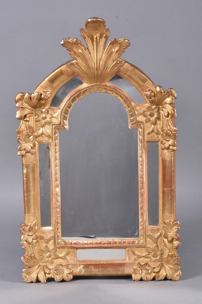 Gilded stuccoed wood mirror decorated with...