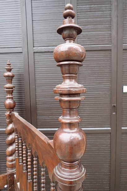 Moulded and carved rosewood bed resting on...