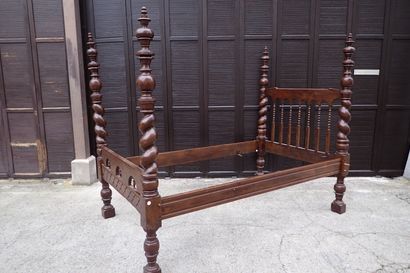 Moulded and carved rosewood bed resting on...