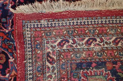 Very large oriental wool carpet in burgundy...