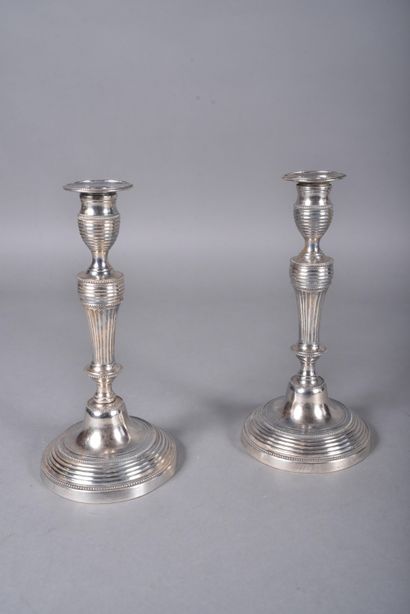 Pair of silver-plated candlesticks with tapered...