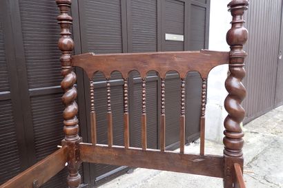 Moulded and carved rosewood bed resting on...