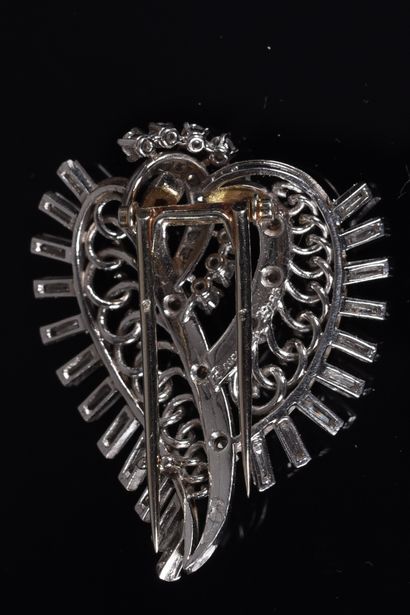BOUCHERON. Leafy or scrolling brooch-clip...