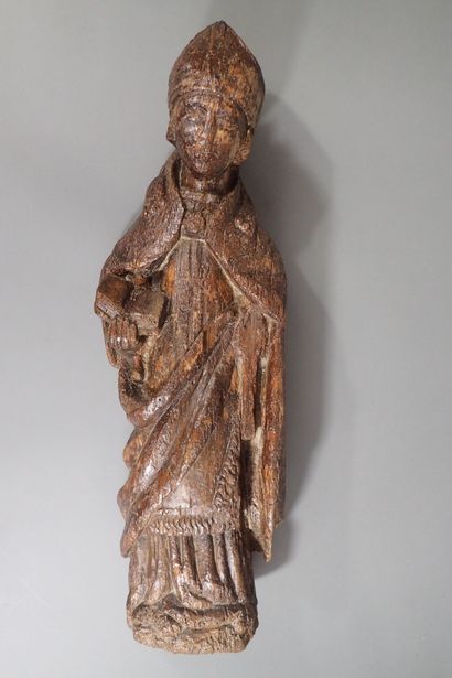 Carved oak statue of a holy bishop. Work...