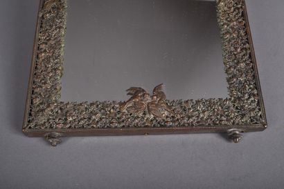 Framed mirror in finely chased bronze with...