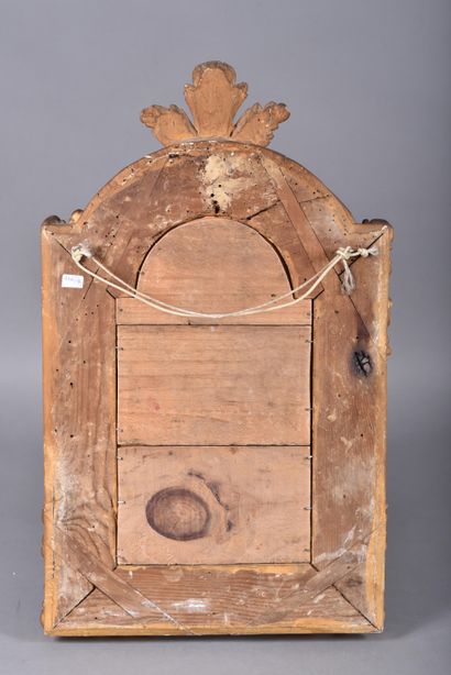 Gilded stuccoed wood mirror decorated with...