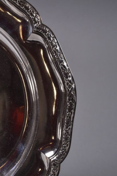 Circular serving dish with scalloped edges...