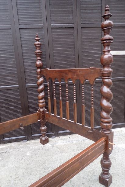 Moulded and carved rosewood bed resting on...