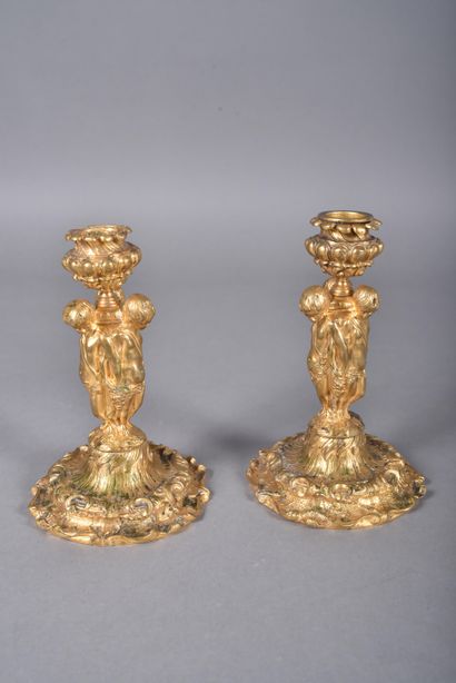 Pair of ormolu candlesticks, the tap in the...
