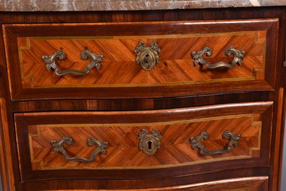 A lady's chest of drawers in veneered marquetry...