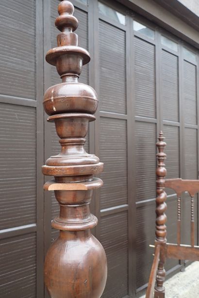 Moulded and carved rosewood bed resting on...