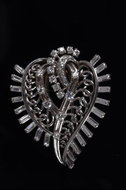 BOUCHERON. Leafy or scrolling brooch-clip...
